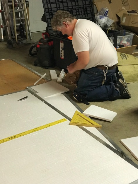 Daniel is piecing together the 1/2" insulation inside the aluminum frame.